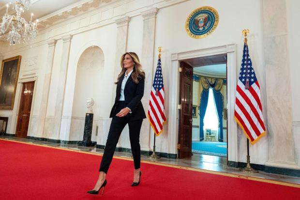 First lady Melania Trump arrives to speak in the Grand Foyer of the White House, Friday, Oct. 10, 2025, in Washington. (AP Photo/Alex Brandon, Pool)