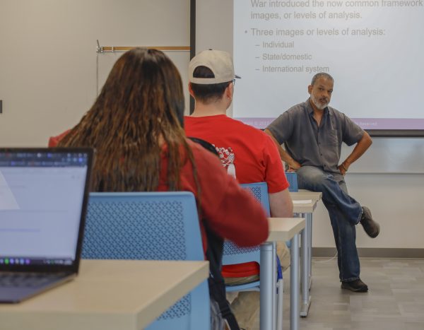 On Friday, October. 2, Professor Van Chaney discusses a few topics involving African American studies with students before passing out an exam during his Political Science class. Chaney Started teaching at ECC in 2006 by connecting with