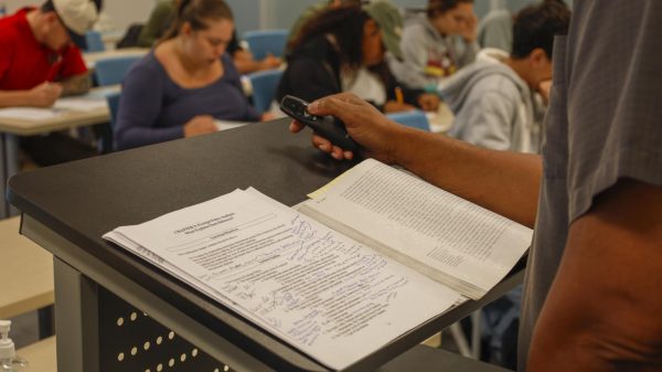 As Students work on an exam, Professor Van Chaney, 57, makes himself available for any questions in relations to the material given on Friday October, 3, 2025. Chaney is a Political Science professor, but started his first teaching position at Southwest College in Spring 2006. In fall 2006 he continued at Southwest, but started teaching at Pierce college and El Camino College. (Madison Moody | The Union)