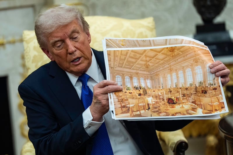 Trump shows off mock-up photos of his planned $300 million ballroom.