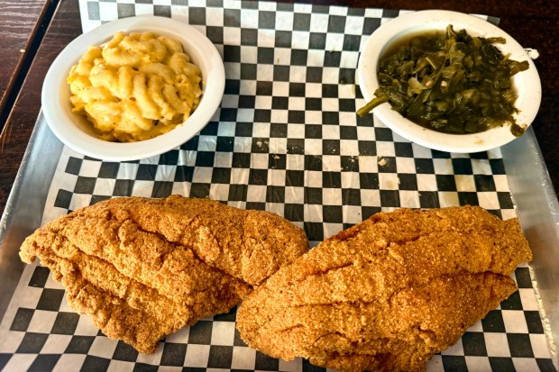 A catfish platter with mac and cheese and collard greens...