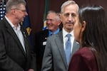 Portland Mayor Keith Wilson speaks with Beaverton Mayor Lacey Beaty at a press conference Monday, Sept. 29 in Portland Ore. Wilson and 10 Oregon mayors spoke against President Trump's decision to deploy the National Guard in Portland.