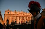 A Swiss guard stands with St Peter's Basilica in the background at St Peter's Square ahead of late Pope Francis' funeral.