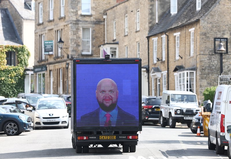 Protesters used a van to display a meme of Vance in the Cotswolds, where the vice president is spending his vacation—his visit to the English beauty spot has attracted backlash from locals in England.
