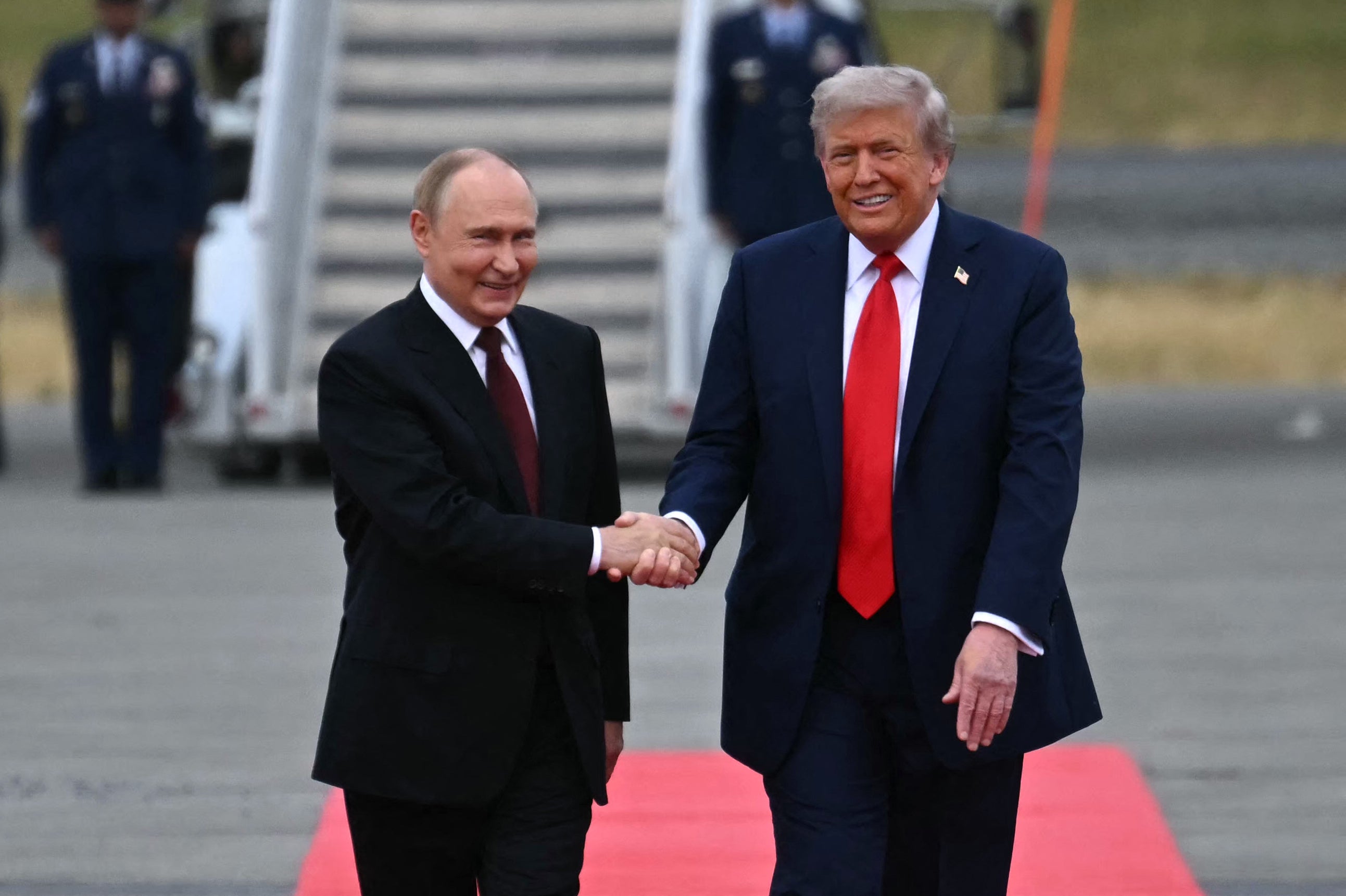 Donald Trump greets Vladimir Putin in Anchorage, Alaska, in August