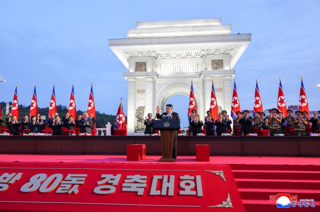 This picture taken on August 14, 2025 and released from North Korea's official Korean Central News Agency (KCNA) via KNS on August 15, 2025 shows North Korea's leader Kim Jong Un (C) delivering a speech at a convention celebrating the 80th anniversary of the liberation of Korea from Japan colonial rule in Pyongyang. (Photo by KCNA VIA KNS / AFP) / South Korea OUT / REPUBLIC OF KOREA OUT ---EDITORS NOTE--- RESTRICTED TO EDITORIAL USE - MANDATORY CREDIT "AFP PHOTO/KCNA VIA KNS" - NO MARKETING NO ADVERTISING CAMPAIGNS - DISTRIBUTED AS A SERVICE TO CLIENTS / THIS PICTURE WAS MADE AVAILABLE BY A THIRD PARTY. AFP CAN NOT INDEPENDENTLY VERIFY THE AUTHENTICITY, LOCATION, DATE AND CONTENT OF THIS IMAGE --- / (Photo by STR/KCNA VIA KNS/AFP via Getty Images)