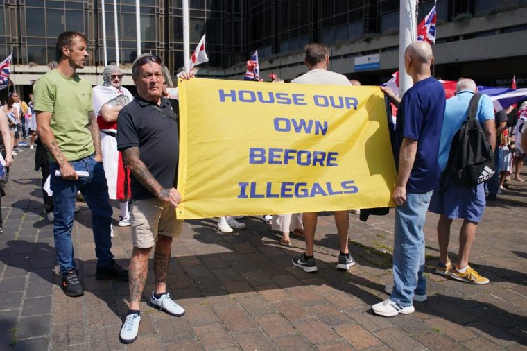 People take part in a counter protest to the Stand Up To Racism rally in Guildhall Square, Portsmouth. Picture date: Friday August 22, 2025. PA Photo. Photo credit should read: Gareth Fuller/PA Wire