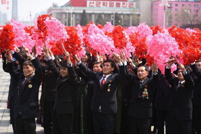 Mandatory Credit: Photo by Xinhua/Shutterstock (8611869h) People with flowers in their hands at a parade in central Pyongyang Day of the Sun, Pyongyang, North Korea - 15 Apr 2017 The Democratic People's Republic of Korea (DPRK) Saturday showcased its military muscles by parading all of its most-advanced ballistic and tactic missiles, including a submarine-launched ballistic missile which could strike targets 1000 km away.