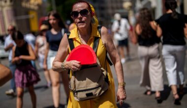 A woman fans herself in Madrid, Spain.