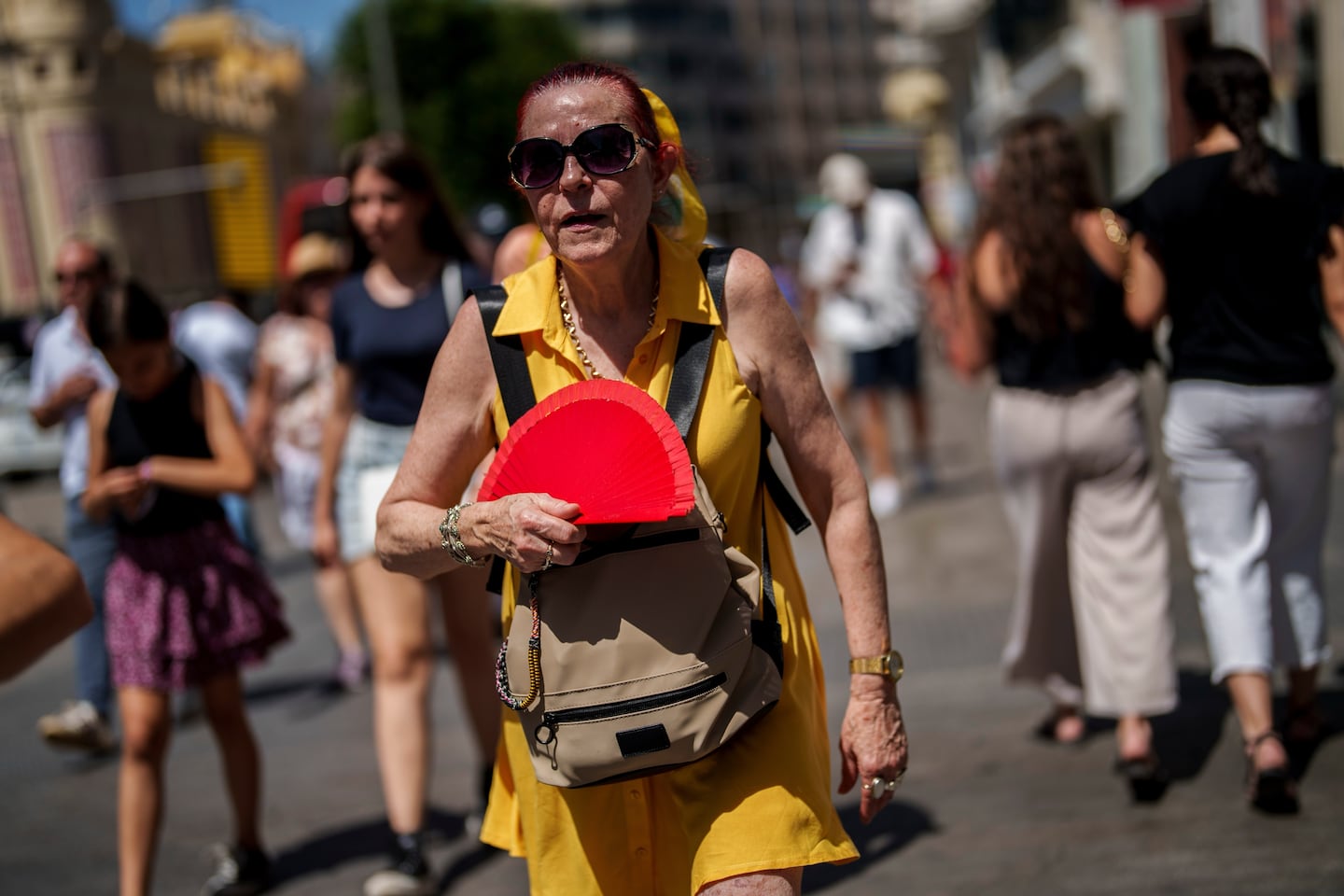 A woman fans herself in Madrid, Spain.