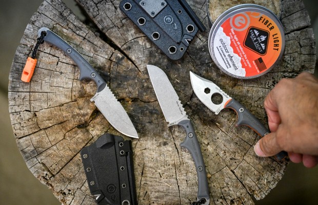 Owner and founder Mike Mojica displays his fire-starting knife, the Scout Feather, at Outdoor Element in Englewood on Tuesday, Sept. 30, 2025. (Photo by AAron Ontiveroz/The Denver Post)