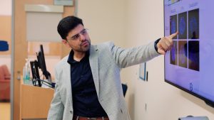 Armin Rad gives a presentation on Encapsulate's technology in a UConn lecture hall