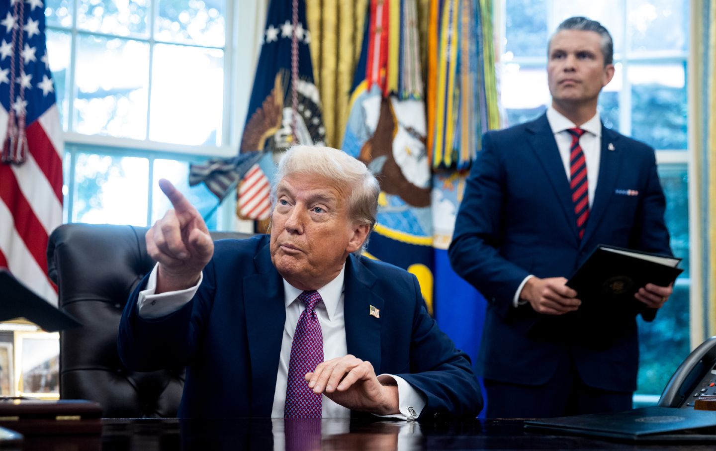 Trump and Hegseth deliver an announcement at the Oval Office