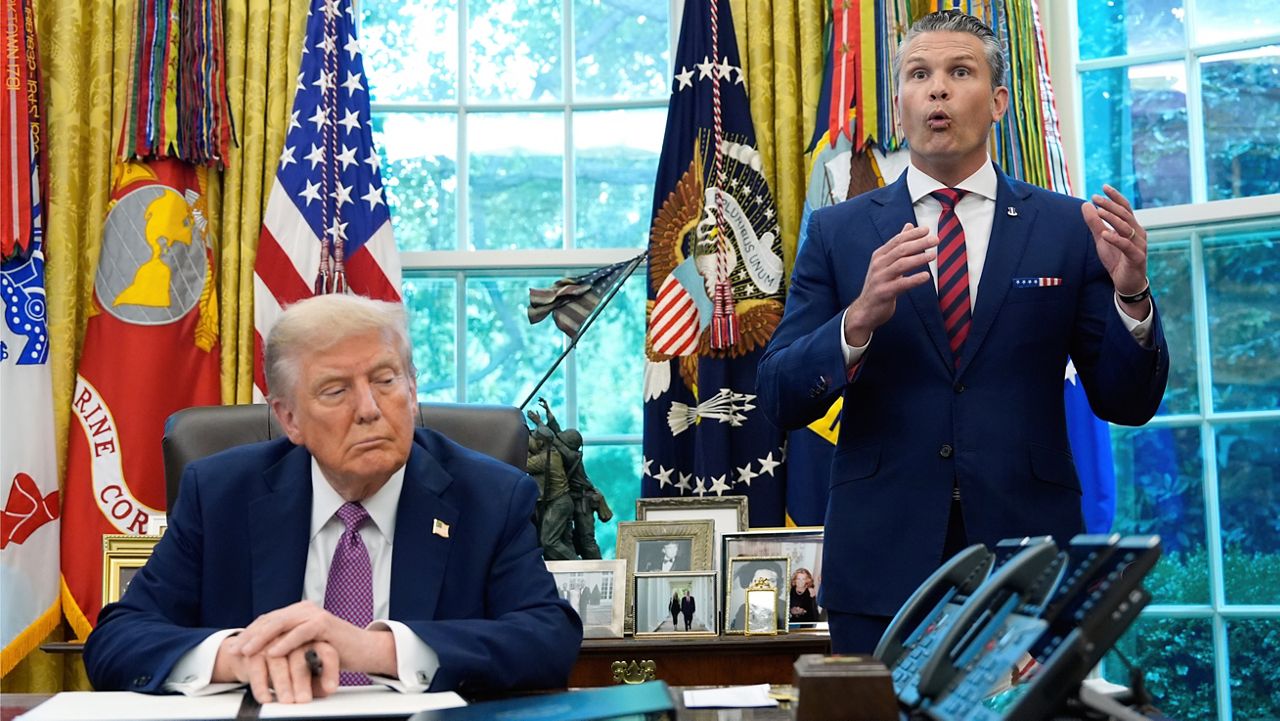President Donald Trump listens as Defense Secretary Pete Hegseth speaks in the Oval Office of the White House, Friday, Sept. 5, 2025, in Washington. (AP Photo/Alex Brandon)