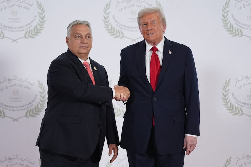 US President Donald Trump greets Hungary's Prime Minister Viktor Orban during a summit on Gaza in Sharm el-Sheikh on October 13, 2025. Trump landed in Egypt on October 13 for a summit on Gaza, following a lightning visit to Israel after a ceasefire he brokered entered into force. (Photo by Evan Vucci / POOL / AFP) (Photo by EVAN VUCCI/POOL/AFP via Getty Images)