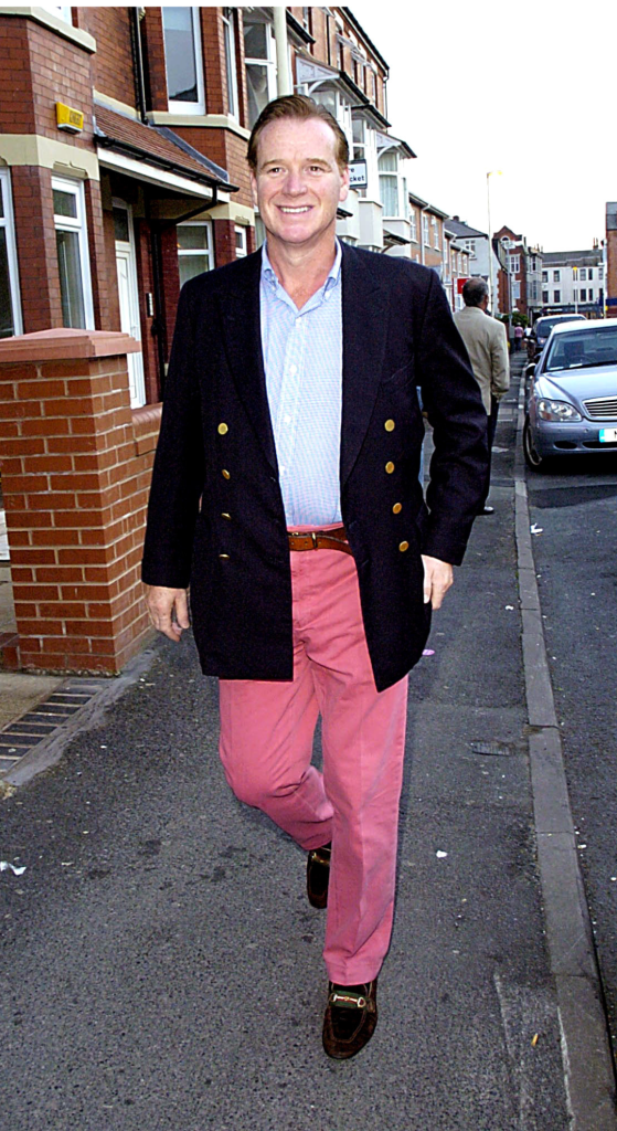 Major James Hewitt wearing red trousers