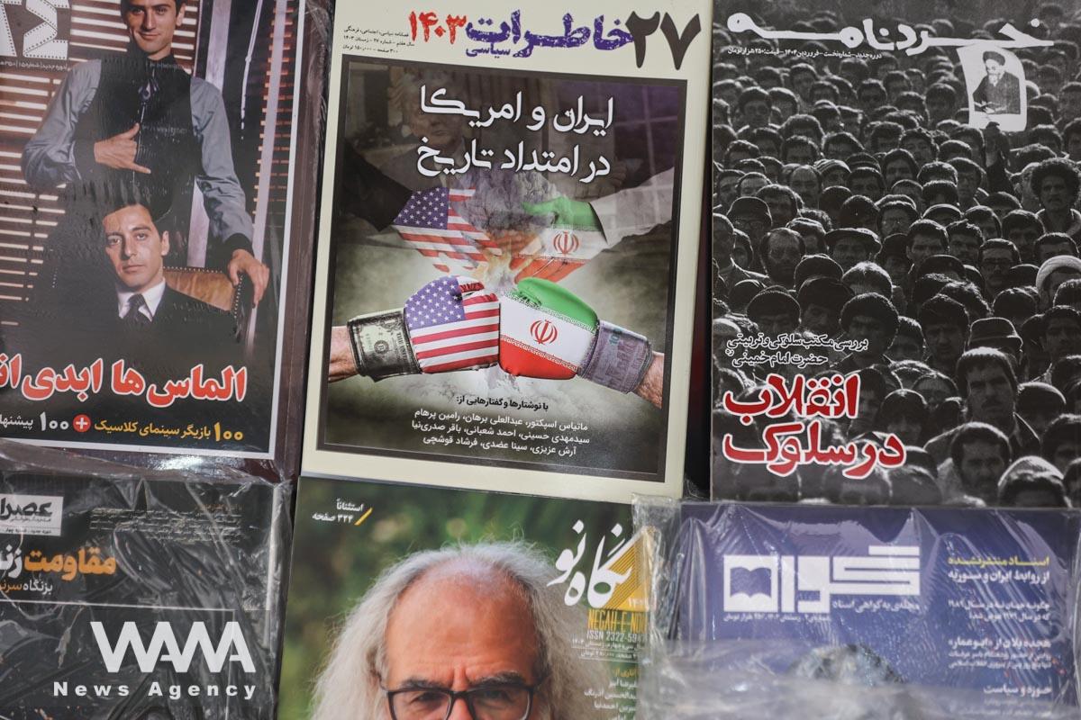 A book with a cover design of the Iran-US negotiations is seen in Tehran