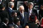 Former President  Biden speaks with attendees as he arrives ahead of the late Pope Francis' funeral.