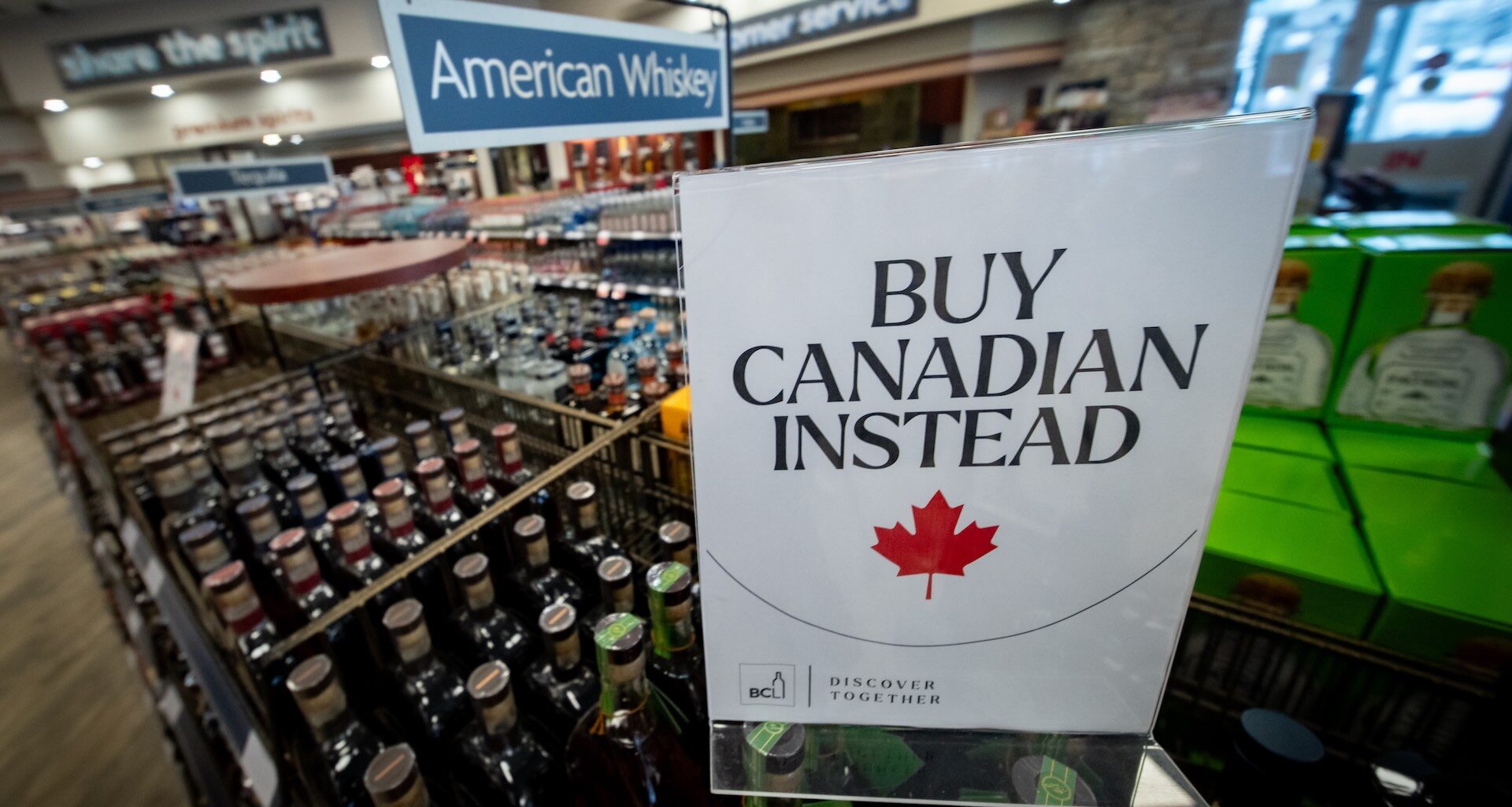 A sign in front of the American whiskey section at a Vancouver liquor store after American-made products were removed from shelves in February 2025.