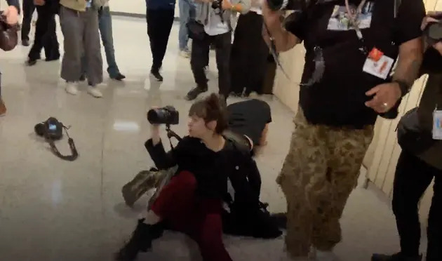 Federova, a photojournalist, fell to the ground after getting shoved by a federal officer. 