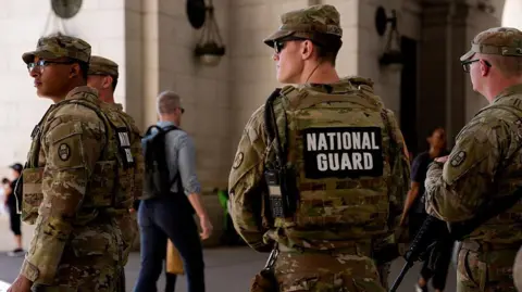 Getty Images National Guard troops deployed in Washington, DC in September stand guard outside Union Station.