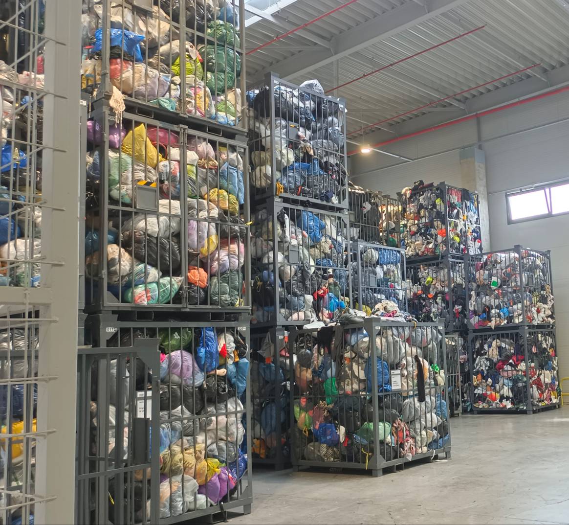 Up to the ceiling - post-consumer garments that have come in through TexCycle containers and other routes. Up to the ceiling - post-consumer garments that have come in through TexCycle containers and other routes.