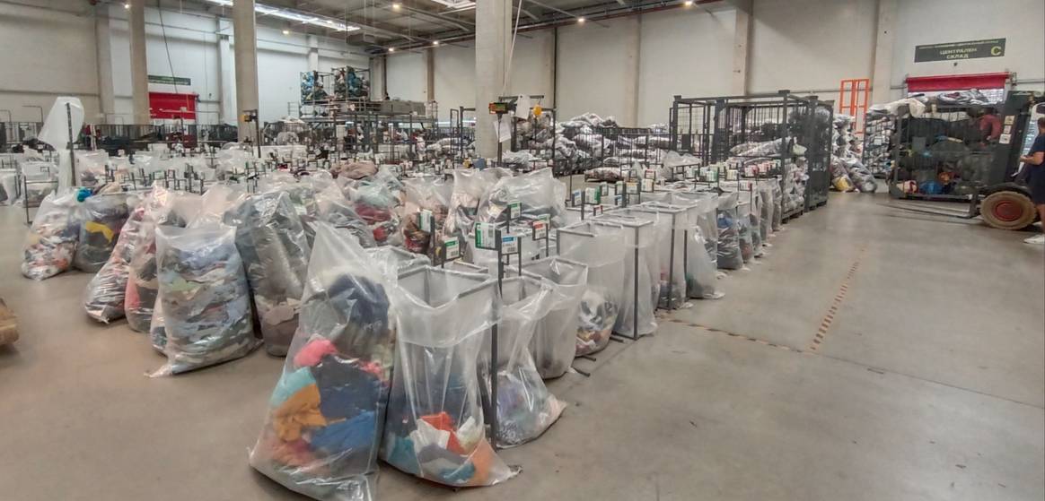 Waiting to be picked up for the ‘local’ market - pre-sorted post-consumer garments. Waiting to be picked up for the ‘local’ market - pre-sorted post-consumer garments.