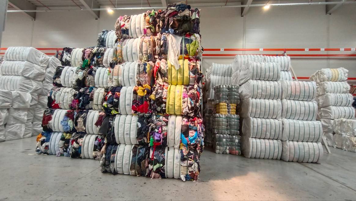 An impressive stack of clothes, pre-sorted and ready for their new life. An impressive stack of clothes, pre-sorted and ready for their new life.