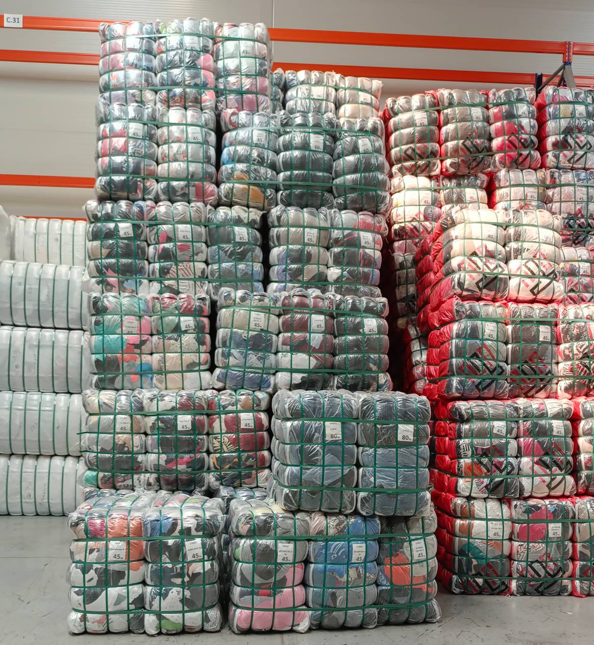 Specific garments as requested by the wholesale client, neatly sorted. Specific garments as requested by the wholesale client, neatly sorted.