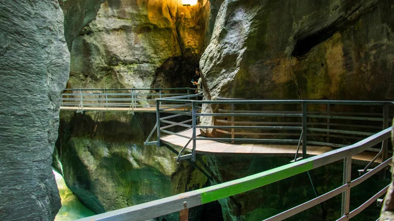 A narrow tunnel system of the winding Aare Gorge accessible trails
