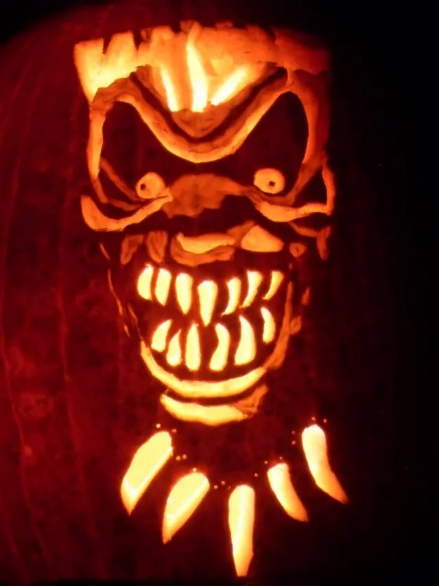 An image of a monster face carved into a pumpkin
