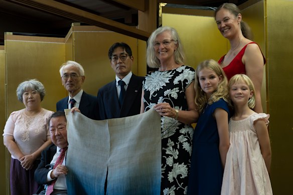 Tasmanian convict descendant Julie Findlay (centre) and her family pictured with descendants of the samurai who repelled the Cyprus.