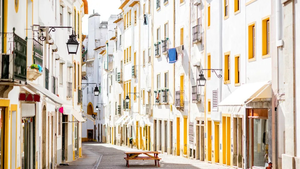 Street view with beautiful old residential buildings in Evora city in Portugal