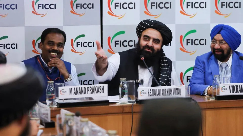 (L to R) Anand Prakash, Joint Secretary of the Pakistan, Afghanistan and Iran (PAI) Division at the Ministry of External Affairs (MEA), Afghanistan's Taliban Foreign Minister Amir Khan Muttaqi and Indian entrepreneur Vikramjit Singh Sahney participate in a roundtable in New Delhi, India on Monday. - Anushree Fadnavis/Reuters