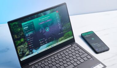 Laptop and smartphone on a table, both connected to Proton VPN Free