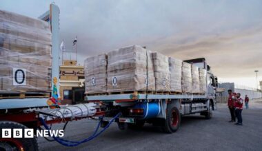 Dozens of aid trucks enter Gaza as Hamas pushes for release of high-profile prisoners - live