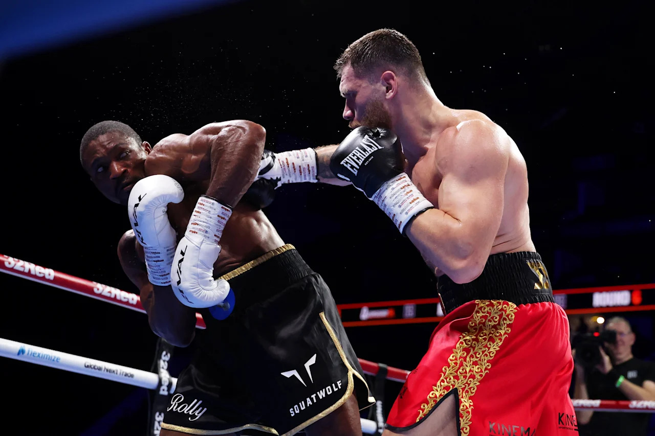 LONDON, ENGLAND - OCTOBER 25: Juergen Uldedaj punches Rolly Lambert during the IBO World Cruiserweight Title fight between Juergen Uldedaj and Rolly Lambert Fogoum on the
