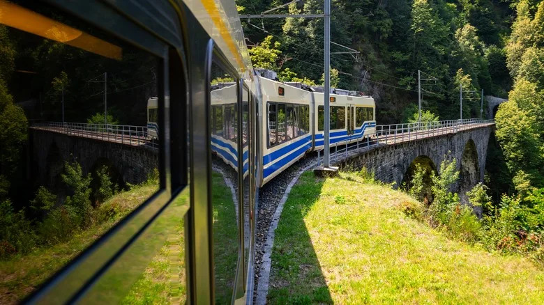 A close-up of a train coming around the bend on the Vigezzina-Centovalli Railway
