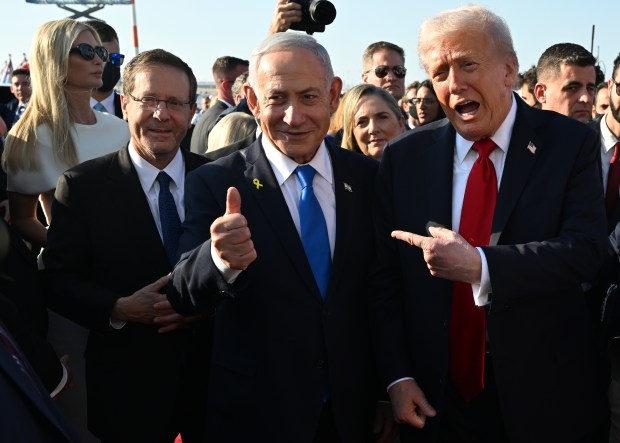U.S. President Donald Trump poses with Israeli President Isaac Herzog...
