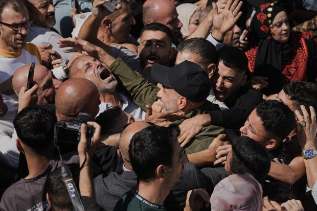 Palestinian prisoners are greeted after being released from Israeli prison...