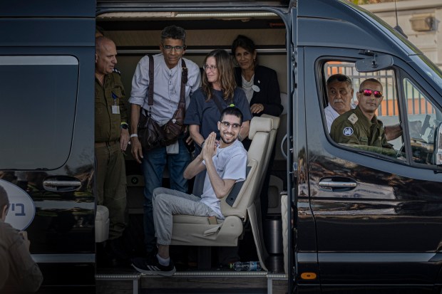 Evyatar David, center, a hostage released from the Gaza Strip,...