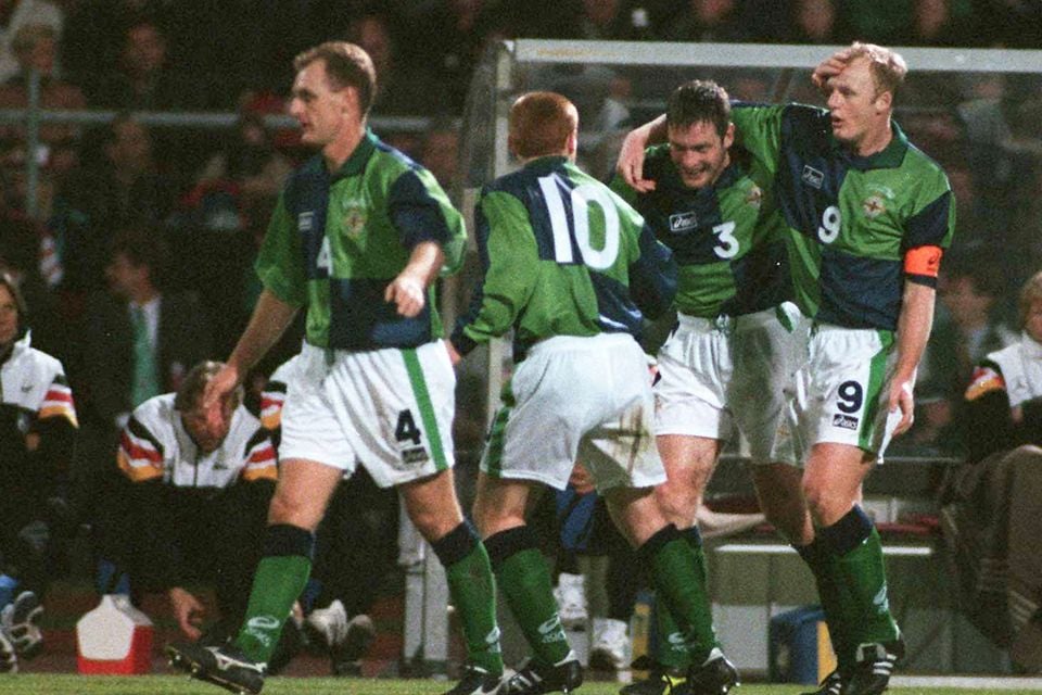 Gerry Taggart is mobbed after his goal against Germany in 1996