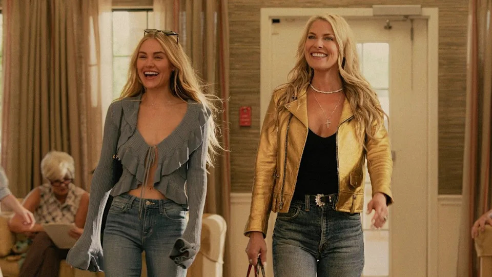  L to R Michelle Randolph as Ainsley Norris and Ali Larter as Angela Norris smiling and walking. . 