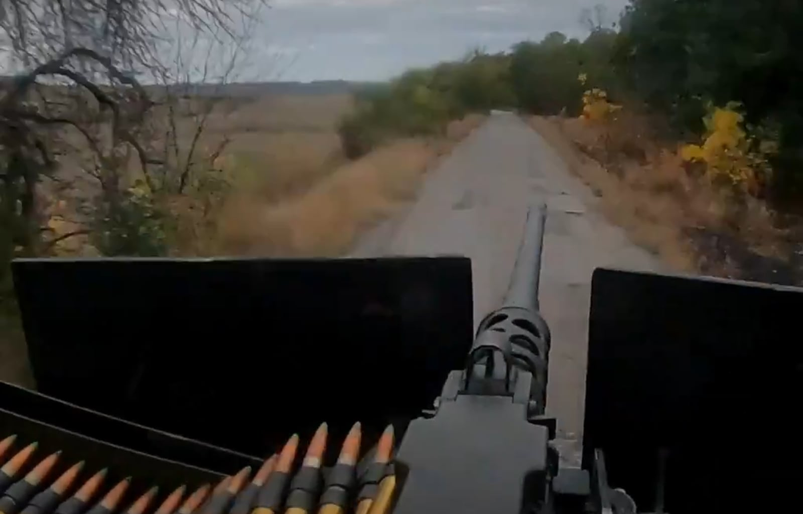 Ukrainian turret gunner of the SOF unit "Artan" of the GUR shoots at Russian positions at full speed and covers the friendly assault group during a storming operation. Published 08.10.2025