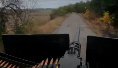 Ukrainian turret gunner of the SOF unit "Artan" of the GUR shoots at Russian positions at full speed and covers the friendly assault group during a storming operation. Published 08.10.2025