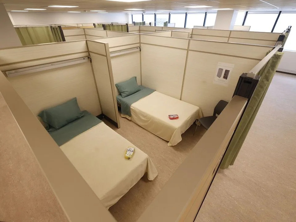 A July file photo showing the second floor at 230 Queen St., the city’s first-ever office to transitional housing conversion.