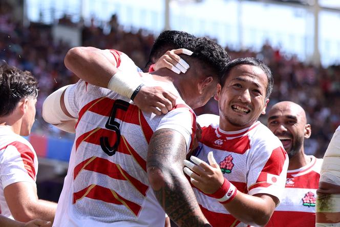 Japanese players celebrate after scoring a try against Chile during the Rugby World Cup, Toulouse, France, September 10, 2023.