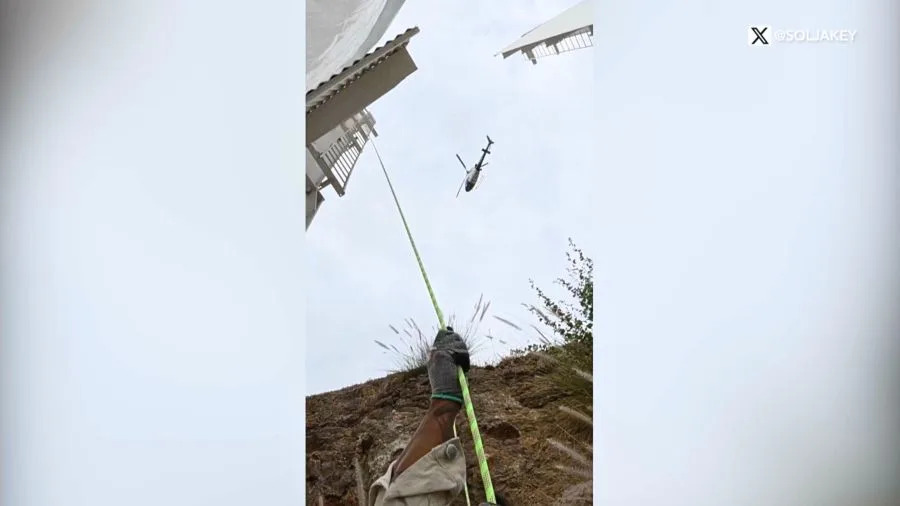 A cryptocurrency crew is seen hanging a tarp on the Hollywood sign. September 2025. (@SoIJakey via X)