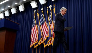 Fed's Powell says economy on firmer footing, QT end in view
