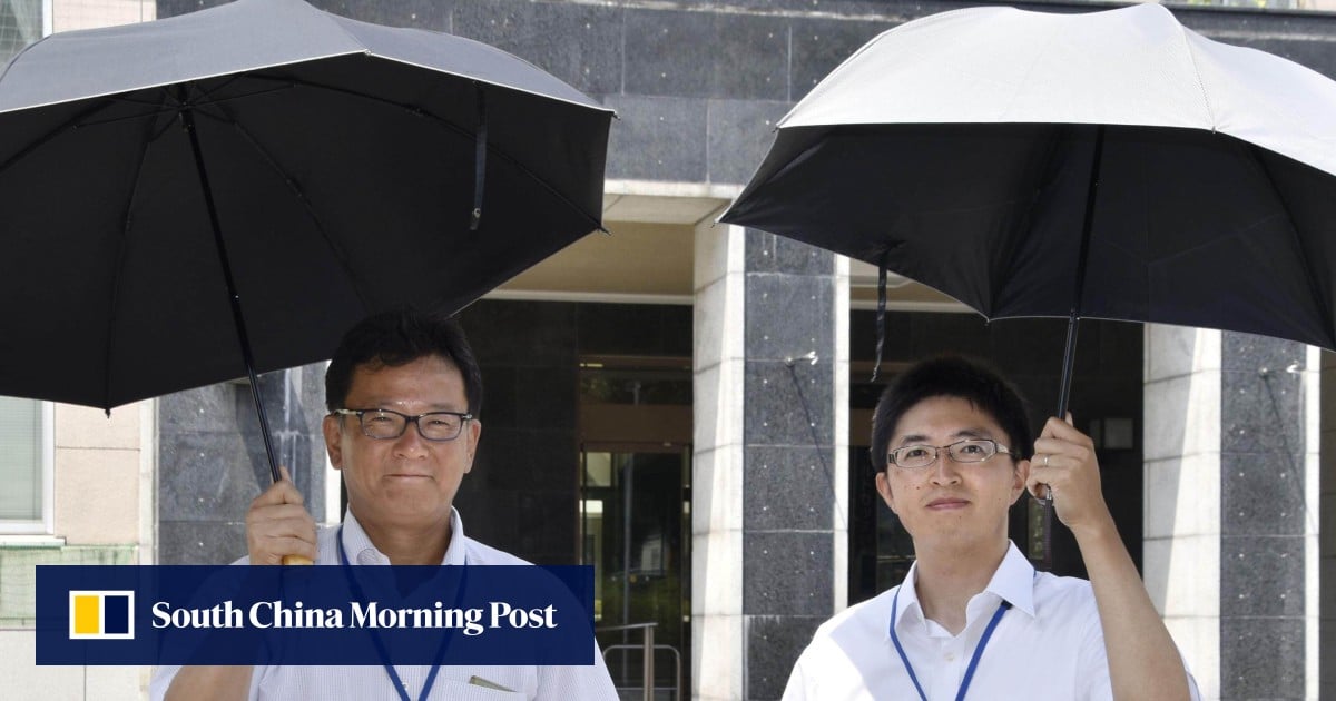 Japanese men drop gender norms to pick up parasols amid record heatwave